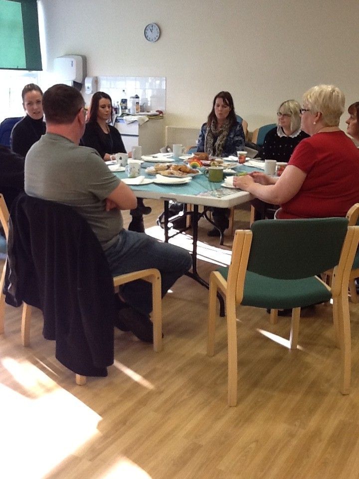 Group sharing breakfast and conversation at a RAGS support meeting