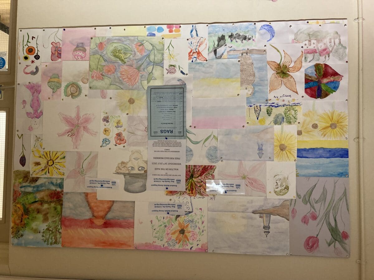 Display board of children's watercolour paintings for RAGS