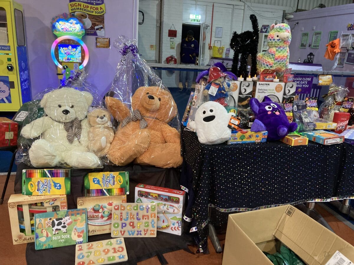 Halloween raffle prizes including teddy bears and a ghost toy at a RAGS event