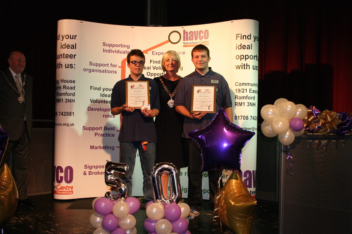 Two young RAGS volunteers receiving certificates at Havco Volunteer Week awards, 2015