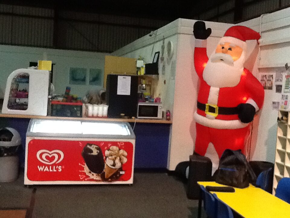 Christmas decorations and ice cream counter inside soft play centre for RAGS party