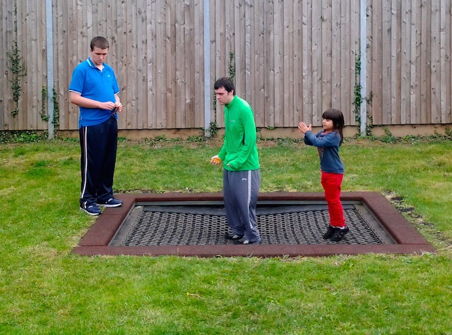 Group enjoying a garden trampoline at a RAGS summer activity, 2014