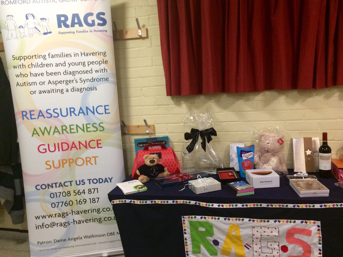 RAGS banner and raffle prizes on display at a quiz night, 2016