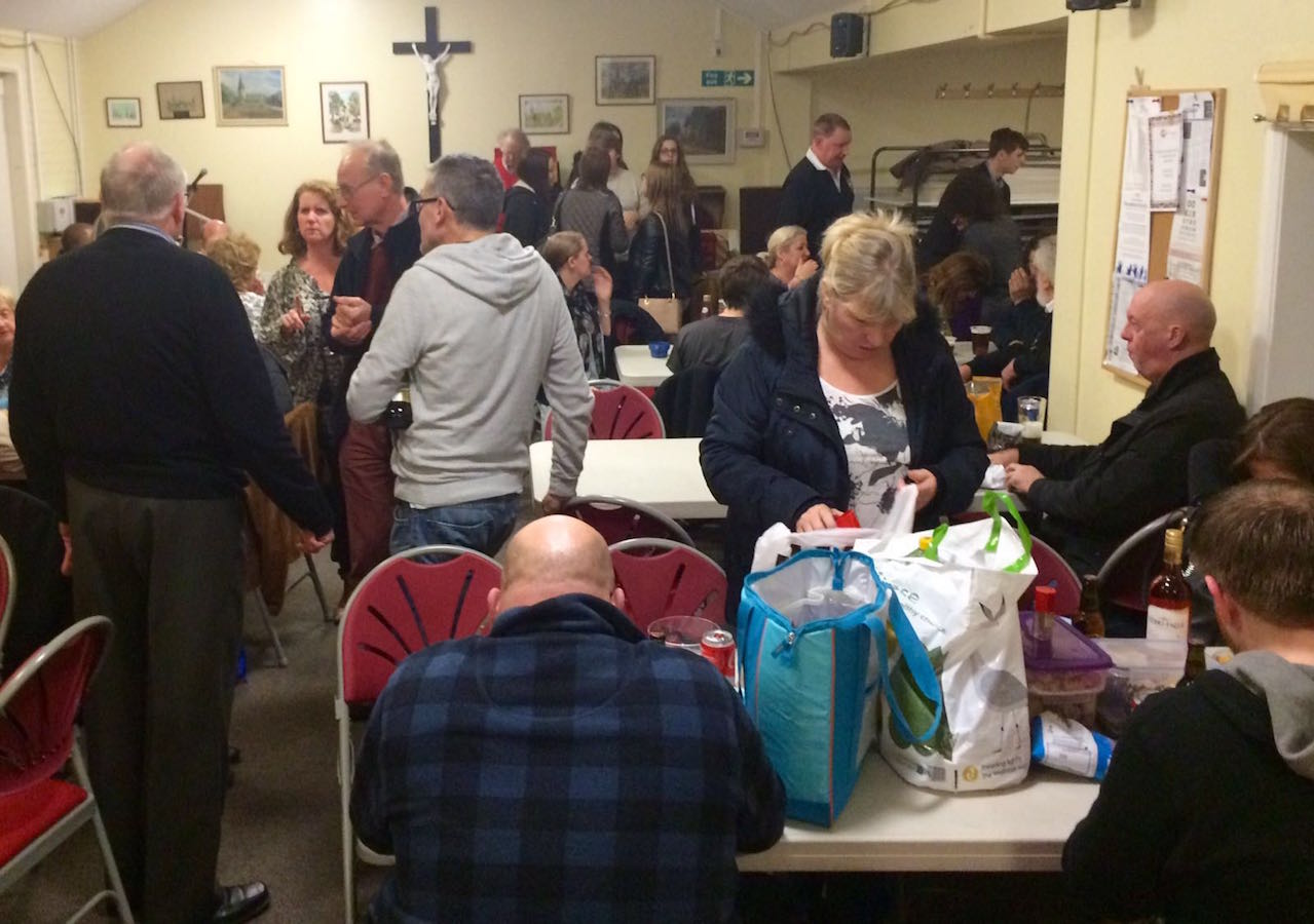 Guests socialising around tables at a RAGS quiz night, 2016