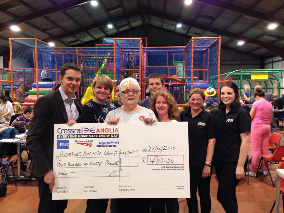 RAGS volunteers receiving a charity cheque from Crossrail Anglia at a soft play centre